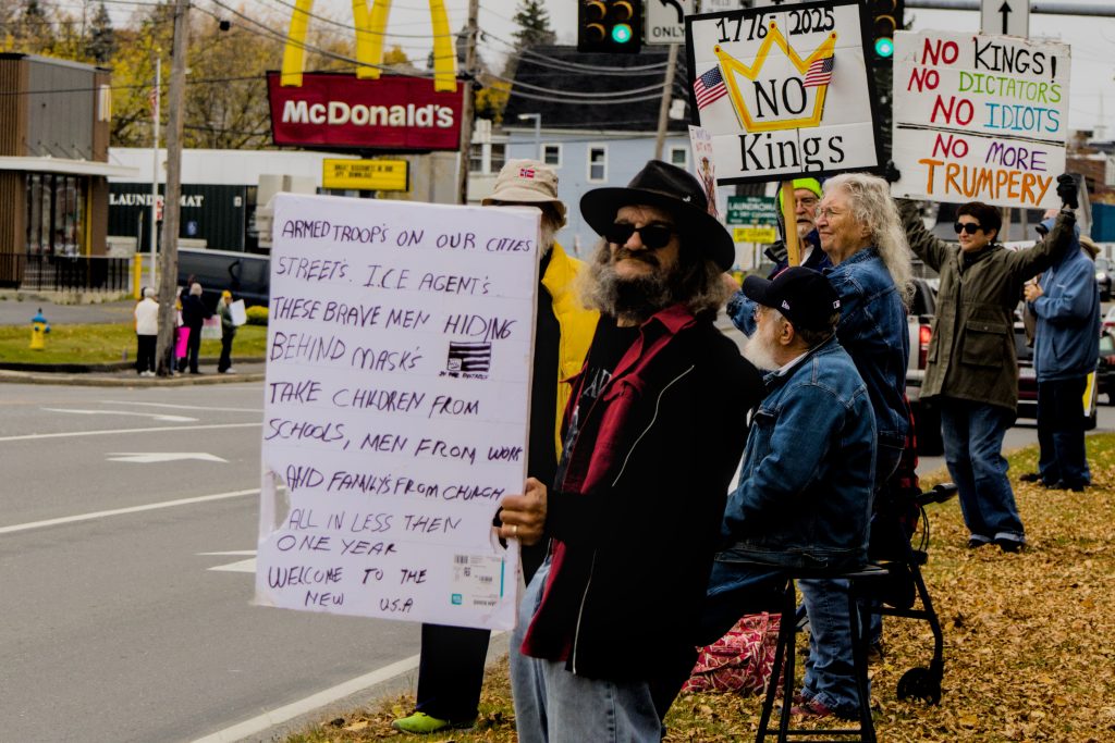 Protesters hold signs during the No Kings protest in Presque Isle, Maine, on October 18th, 2025.