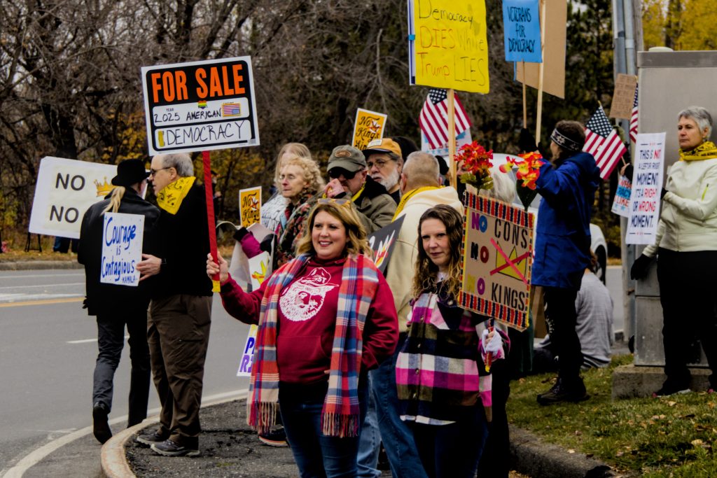 Protesters display signs at the No Kings protest in Presque Isle, Maine, on October 18th, 2025.