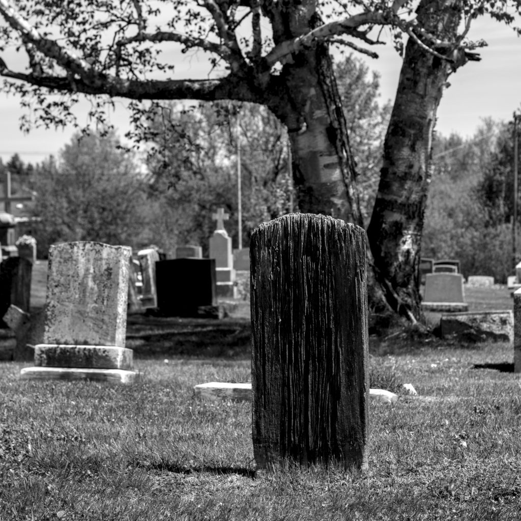 An old wooden grave marker (is it still called a tombstone?)