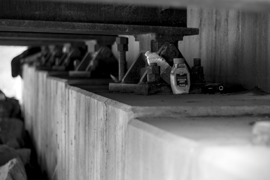 An old bottle of light mayonnaise is left to ferment under the State Street bridge.